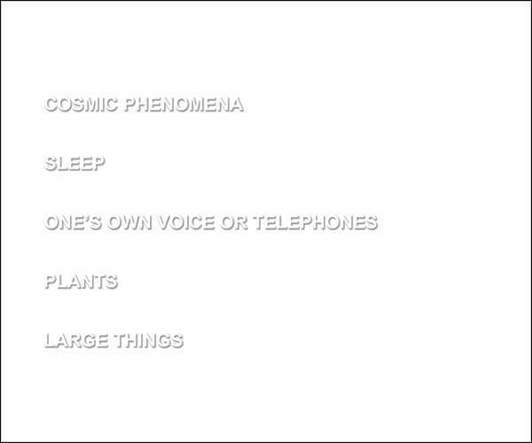 a white card with embossed text which reads cosmic phenomena sleep one's own voice or telephones plants large things