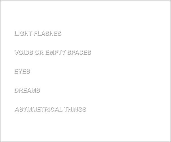 a white card with embossed text which reads light flashes voids or empty spaces eyes dreams asymmetrical things